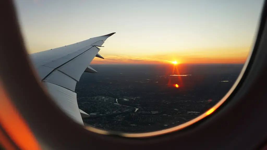 View from an aircraft window at sunset over the city