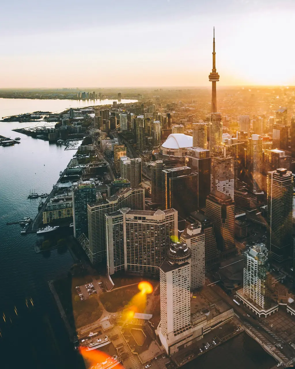 Aerial view of downtown Toronto and the lakeshore at golden hour